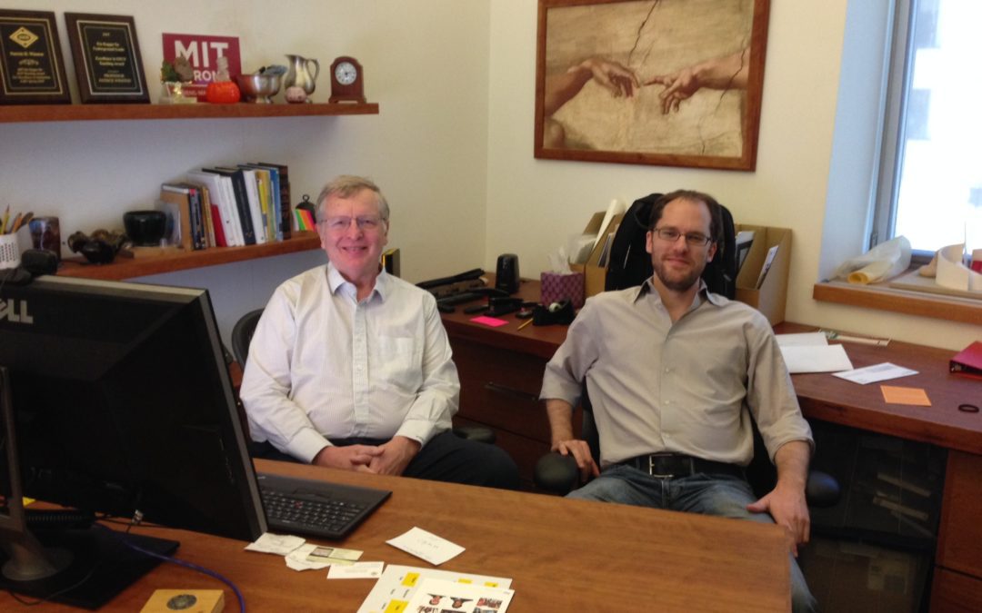 Photo of 2 men in an office.